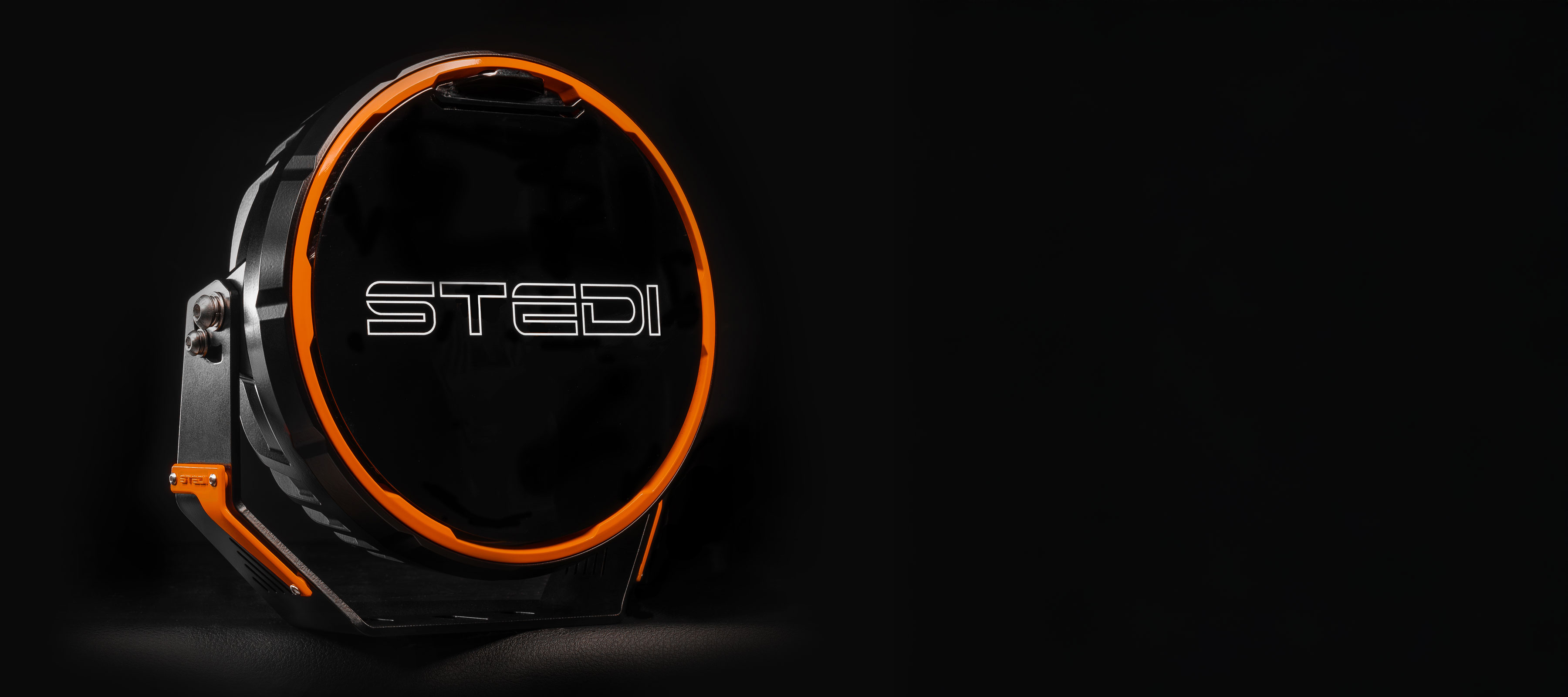 A lone Type-X™ Sport Plus LED Driving Light, on a black backdrop