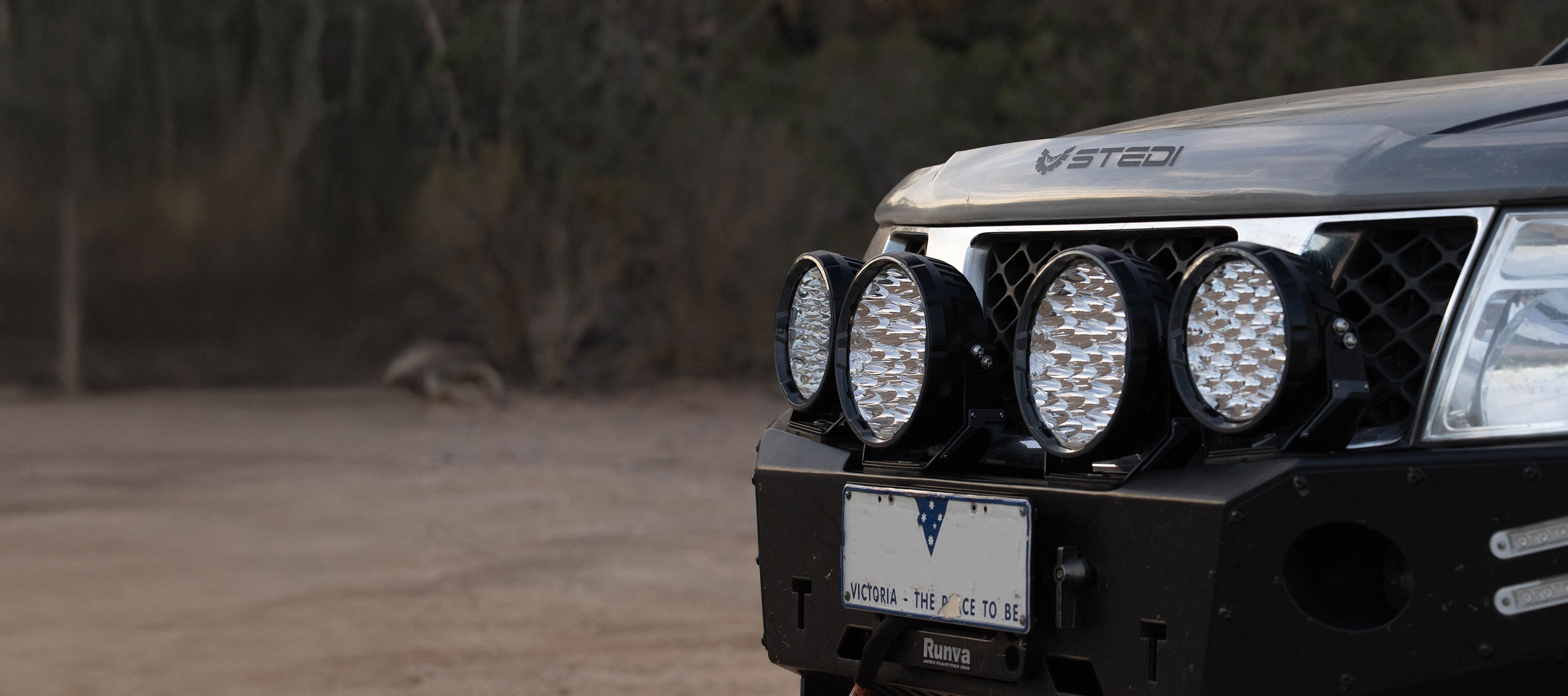 A Black Navarra with 4 Sport Plus Driving Lights fit to a bull bar.